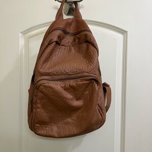 can you put pins on a leather backpack How do I put pins on my loungefly backpack without ruining it? Are there  special tricks or special equipment for them? I'm getting a Papa IV backpack  from Ghost and I wanna